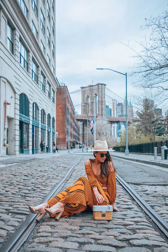 Kristi Hemric (Instagram: @khemric) makes herself comfortable for the perfect photo in Dumbo, Brooklyn