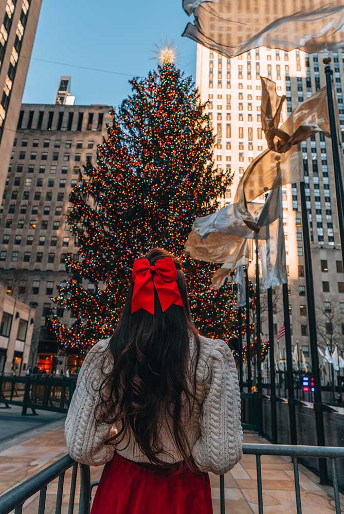 Kristi Hemric (Instagram: @khemric) checks out the iconic Rockefeller Center Christmas Tree in New York, NY