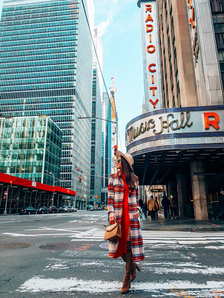 Kristi Hemric (Instagram: @khemric) walks down an empty 6th Avenue in New York near Radio City Music Hall